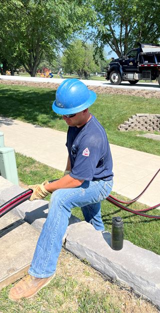 Man works with electric wire